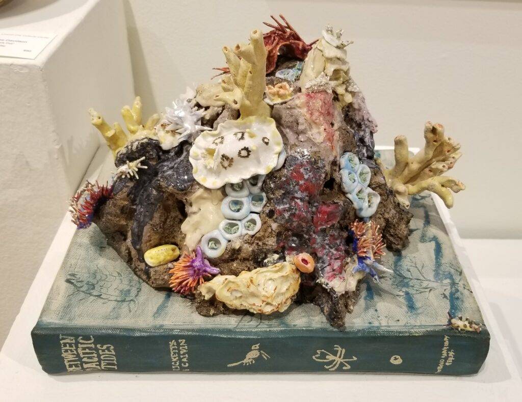 Sculpture of coral atop an old book
